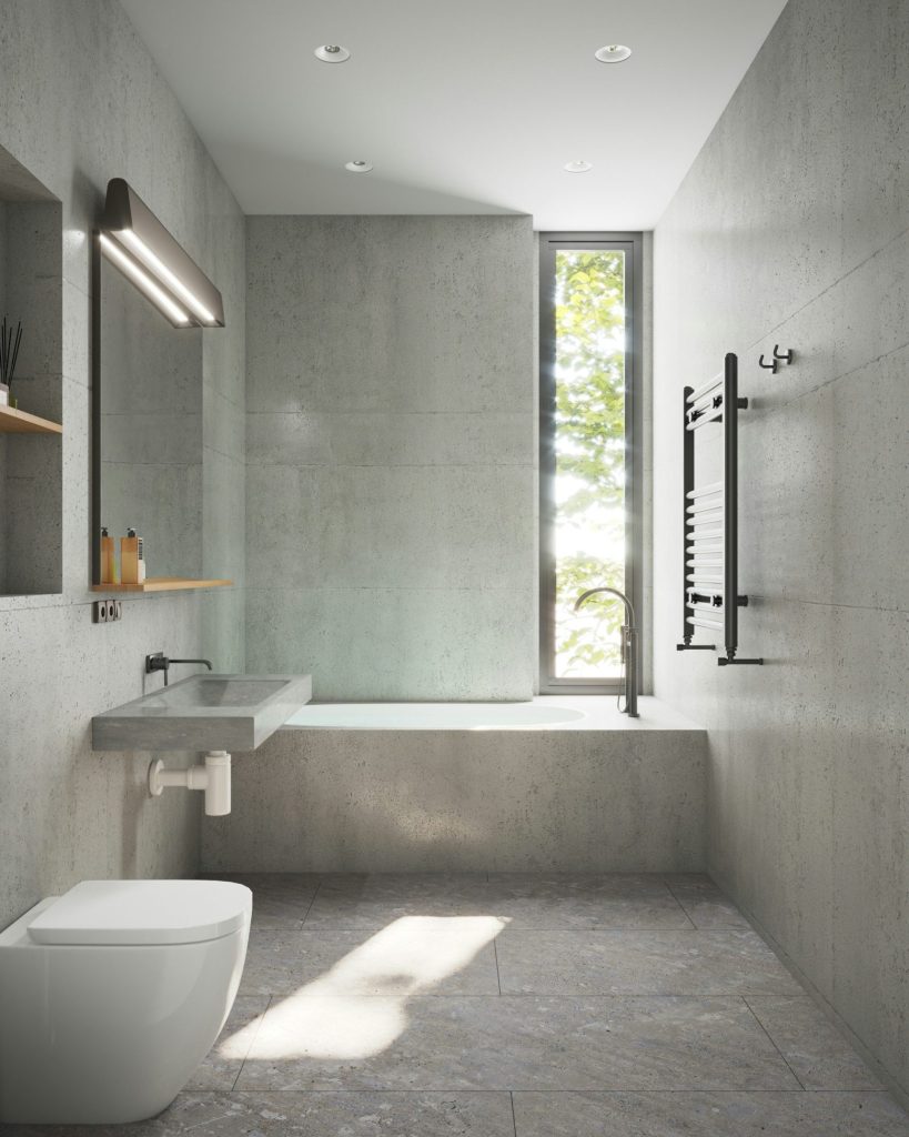 Ein Badezimmer mit Toilette, Waschbecken und Badewanne.